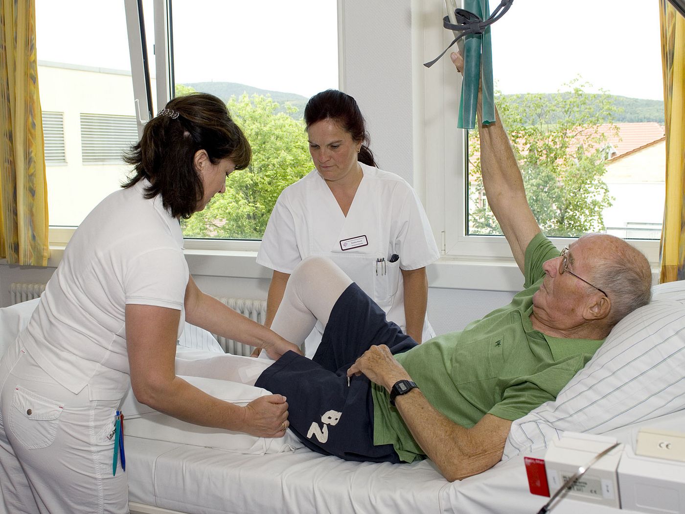 Patient und Pflegekräfte